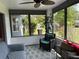 Cozy screened porch with comfortable seating and views of the backyard at 6082 Sw 104Th St, Ocala, FL 34476