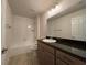 Bathroom featuring a large mirror, bathtub, and toilet at 6134 Sw 155Th Street Road, Ocala, FL 34473