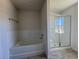 Bathroom with a bathtub and shower at 6134 Sw 155Th Street Road, Ocala, FL 34473