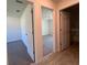Hallway view showing two bedrooms and a bathroom at 6134 Sw 155Th Street Road, Ocala, FL 34473
