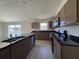 Spacious kitchen features dark countertops and stainless steel appliances at 6134 Sw 155Th Street Road, Ocala, FL 34473