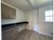 Bright laundry room with overhead lighting and plenty of storage space at 6134 Sw 155Th Street Road, Ocala, FL 34473