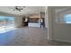 Open floor plan with durable flooring, neutral walls, and big sliding glass doors to the outside at 6134 Sw 155Th Street Road, Ocala, FL 34473