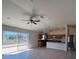 Open floor plan showcasing a combined living room and kitchen with sleek countertops and modern fixtures at 6134 Sw 155Th Street Road, Ocala, FL 34473