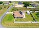 Aerial view of home with fenced yard, solar panels, detached garage, and large driveway at 6890 Sw 128Th Pl, Ocala, FL 34473