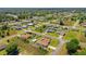 Community aerial view showcasing the property in a neighborhood with mature trees and well-maintained homes at 6890 Sw 128Th Pl, Ocala, FL 34473