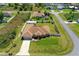 Bird's eye view of a cozy home surrounded by lush greenery, featuring a fenced yard and well-kept lawn at 6890 Sw 128Th Pl, Ocala, FL 34473