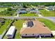 Aerial view of the home featuring a solar panels, fenced yard, and detached shed at 6890 Sw 128Th Pl, Ocala, FL 34473
