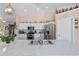 Well-appointed kitchen with stainless appliances, white cabinets, and a large sink at 6890 Sw 128Th Pl, Ocala, FL 34473