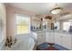 Bright bathroom with a marble garden tub, double sinks, and generous vanity lighting at 6890 Sw 128Th Pl, Ocala, FL 34473