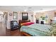 Relaxing main bedroom with a ceiling fan, ample natural light and laminate floors at 6890 Sw 128Th Pl, Ocala, FL 34473