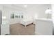 Bright bedroom features neutral walls, carpet floors, and white furnishings at 8218 Sw 92Nd Cir, Ocala, FL 34481
