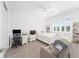 Cozy bedroom features a desk and chair, bright natural light, and neutral walls at 8218 Sw 92Nd Cir, Ocala, FL 34481