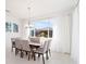 Bright dining room features neutral walls, light tile floors, and backyard views at 8218 Sw 92Nd Cir, Ocala, FL 34481