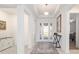 Bright foyer featuring high ceilings, tiled floors, and a decorative rug at 8218 Sw 92Nd Cir, Ocala, FL 34481