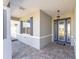Covered front porch featuring a blue front door and brick paver flooring at 8218 Sw 92Nd Cir, Ocala, FL 34481