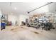 Spacious garage with ample room for parking, storage, and hobbies, featuring organized shelving and clean flooring at 8218 Sw 92Nd Cir, Ocala, FL 34481