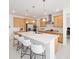 Kitchen boasts a large center island with seating and modern stainless steel appliances at 8218 Sw 92Nd Cir, Ocala, FL 34481