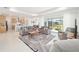 Bright living room featuring a modern design with tile floors, and sliding glass doors to the outdoors at 8218 Sw 92Nd Cir, Ocala, FL 34481