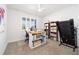Bright home office with carpet, ceiling fan, and built-in desk at 8218 Sw 92Nd Cir, Ocala, FL 34481