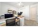 Bright home office with carpet, ceiling fan, and built-in desk at 8218 Sw 92Nd Cir, Ocala, FL 34481