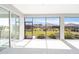 A covered patio area features tiled floors and views of the landscaped backyard at 8218 Sw 92Nd Cir, Ocala, FL 34481