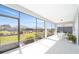 A covered patio area features a dining set and views of the landscaped backyard at 8218 Sw 92Nd Cir, Ocala, FL 34481