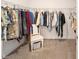 Spacious walk-in closet featuring carpet floors and plentiful built-in storage at 8218 Sw 92Nd Cir, Ocala, FL 34481