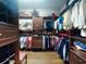 Walk-in closet with custom organizers for shoes, clothes, and accessories at 9172 Se 130Th Loop, Summerfield, FL 34491