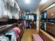 A large walk in closet with wood floor, shelves and plenty of storage for organizing at 9172 Se 130Th Loop, Summerfield, FL 34491