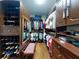 Spacious walk-in closet with custom shelving and ample storage for clothing and accessories at 9172 Se 130Th Loop, Summerfield, FL 34491