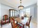Bright dining room with tile floors, large window, and traditional furniture at 9172 Se 130Th Loop, Summerfield, FL 34491