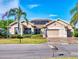 Charming single-story home featuring solar panels, two-car garage, and lush landscaping in a tranquil setting at 9172 Se 130Th Loop, Summerfield, FL 34491