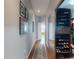 Hallway features a mirrored closet and leads to an open room bathed in natural light at 9172 Se 130Th Loop, Summerfield, FL 34491