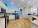 Bright kitchen with stainless steel appliances, tile backsplash, and ample counter space at 9172 Se 130Th Loop, Summerfield, FL 34491