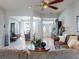 A well lit living room with tiled floors showcases an open floor plan and inviting space at 9172 Se 130Th Loop, Summerfield, FL 34491