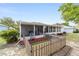 Charming backyard view with screened-in patio, wood fence and manicured landscaping at 9741 Sw 97Th Ln, Ocala, FL 34481