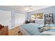Bright bedroom with wood floors, and a large closet with plenty of space at 9741 Sw 97Th Ln, Ocala, FL 34481