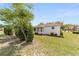 Well-maintained exterior view showcasing the home's side and landscaped yard at 9741 Sw 97Th Ln, Ocala, FL 34481