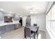Modern kitchen featuring gray cabinets, stainless steel appliances, and a cozy dining area at 9741 Sw 97Th Ln, Ocala, FL 34481