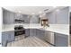 Well-equipped kitchen showcasing stainless steel appliances, sleek countertops, and ample cabinet space at 9741 Sw 97Th Ln, Ocala, FL 34481