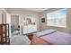 Bright bedroom with carpet and a window is furnished with a white dresser and decor at 9856 Sw 100Th Ter, Ocala, FL 34481