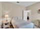 Bedroom featuring neutral walls and a view into an adjacent room at 9856 Sw 100Th Ter, Ocala, FL 34481