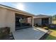 Relax in this home's screened lanai with views of the lawn and a view of the neighboring home at 9856 Sw 100Th Ter, Ocala, FL 34481