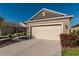 Attractive single-Gathering home with a two-car garage, manicured landscaping, and a welcoming front facade at 9856 Sw 100Th Ter, Ocala, FL 34481
