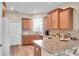 Kitchen featuring granite countertops, stainless steel appliances, and ample cabinet space at 9856 Sw 100Th Ter, Ocala, FL 34481