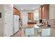 Kitchen featuring granite countertops, stainless steel appliances, and barstool seating at 9856 Sw 100Th Ter, Ocala, FL 34481