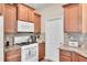 Kitchen featuring stainless steel appliances, granite countertops, and tile backsplash at 9856 Sw 100Th Ter, Ocala, FL 34481