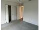 Carpeted bedroom with a ceiling fan and closet shows access to the rest of the home at 11014 Sw 73Rd Cir, Ocala, FL 34476