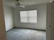 Cozy bedroom featuring neutral carpet, a ceiling fan, a window and an ample closet at 11014 Sw 73Rd Cir, Ocala, FL 34476